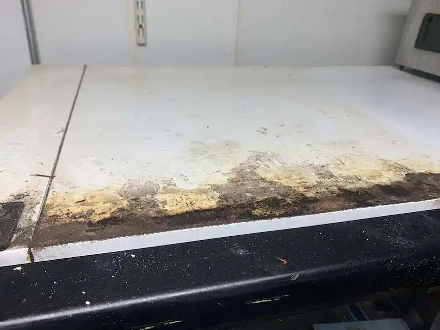 The same kitchen cabinet before detailed cleaning